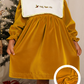 Vestido de veludo com gola bordada amovível
